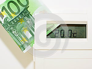 Concept thermostat and banknote for heating expensive