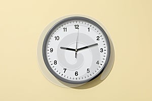 Concept of time change with clock on beige background