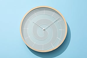 Concept of time change with clock on blue background
