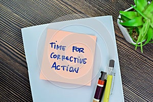 Concept of Time For Corrective Action write on sticky notes isolated on Wooden Table