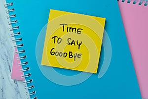 Concept of Time To Say GoodBye write on sticky notes isolated on Wooden Table