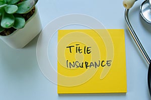 Concept of Title Insurance write on sticky notes with stethoscope isolated on white background