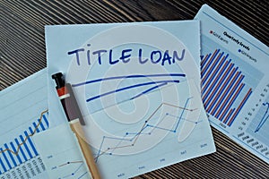 Concept of Title Loan write on sticky notes isolated on Wooden Table