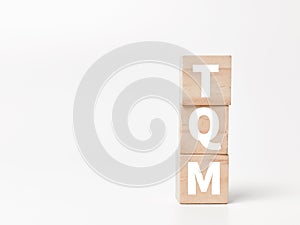 Concept of total quality management on wooden cubes.