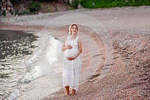 Concept of travel in pregnancy, healthy vacation. Portrait of middle aged pregnant woman. Purity