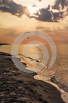 The concept of travel and rest at the seaside, sea waves on the background of the shoreline and sunset