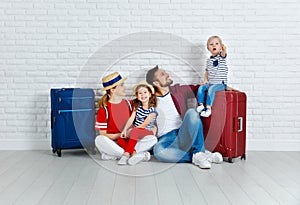 Concept travel and tourism. happy family with suitcases