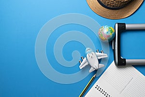 Concept of travel vacation trip and long summer weekend planning on blue table background