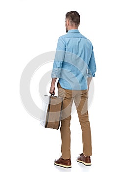 Concept of traveller man with luggage enjoying his days off and taking a vacation