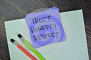 Concept of Trust, Honesty, Respect write on sticky notes isolated on Wooden Table
