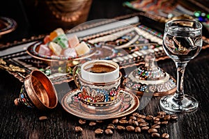 The concept of Turkish cuisine. Turkish brewed black coffee. Beautiful coffee serving in the restaurant. Background image