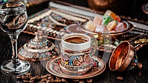 The concept of Turkish cuisine. Turkish brewed black coffee. Beautiful coffee serving in the restaurant. Background image