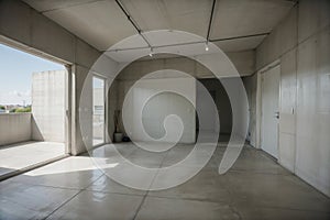 Unveiling Modernity A Wide Shot of an Architecturally Designed Concrete Room.AI Generated photo