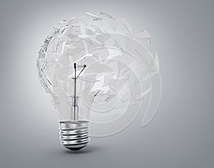 Concept of a utopian idea. Broken light bulb photo