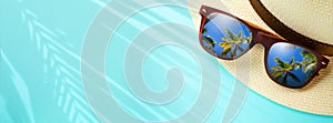 concept vacation and summer travel banner. Happy holidays on sandy tropical sea beach. Panama hat and sunglasses with a reflection