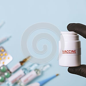 Concept of vaccination, treatment and medicine infectious: Nurse holding in hand tube with Virus Vaccine