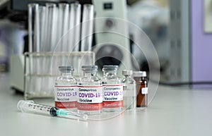 Concept vaccine against covid-19 coronavirus Omicron BA.2, a bottle of vaccine in a scientific laboratory that is a prototype for