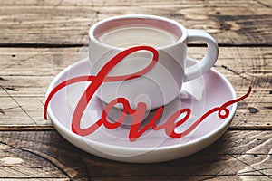 Concept Valentine`s Day. Coffee Cup on wooden table, Copy space