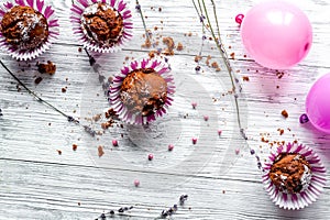 Concept of Valentine`s Day cupcakes wooden background top view