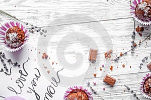 Concept of Valentine`s Day cupcakes wooden background top view