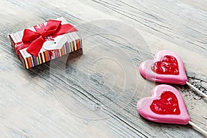 concept of Valentine& x27;s Day is a heart-shaped sugar candy with a gift box. gift and congratulations on Valentine