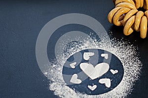 Concept Of Valentine`s Day. Picture of heart of flour on a black background. Happy Valentines Day background