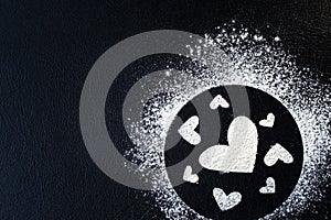 Concept Of Valentine& x27;s Day. Picture of heart of flour on a black background. Happy Valentines Day background. Space for text