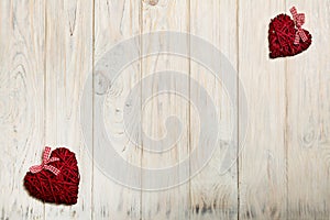 Concept Of Valentine's Day. Wicker hearts on wooden background w