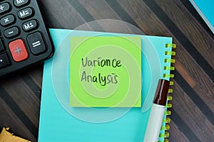 Concept of Variance Analysis write on sticky notes isolated on Wooden Table