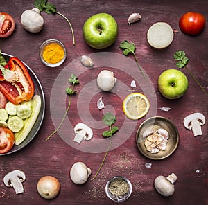 Concept of vegetarian food preparation of salad various vegetables and fruits pan rustic wooden background top view close up