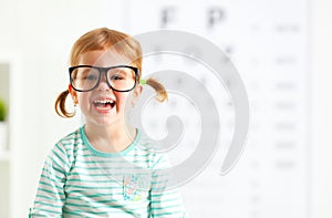 Concept vision testing. child girl with eyeglasses