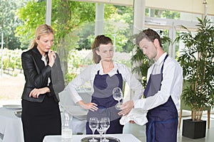 concept waiter cleaning glass