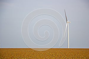 Concept of wind generator in the field, clean ecological energy production, background for copy space