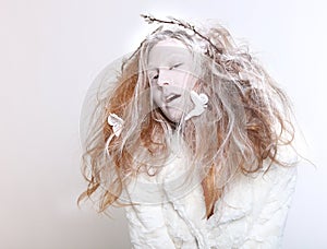 Concept of a Woman in Elaborate Make up and Hair photo