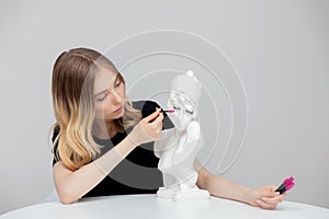 Concept woman eyelash extension practitioner uses brush for her daily care