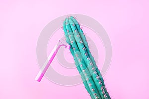 Concept of woman female shaving: pink razer on a pink background shave a cactus, copy space, advertizing, coupon flyer creative