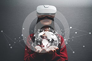 Concept of woman wearing VR glasses .Communication technology and internet worldwide for business concept.Woman hand holding