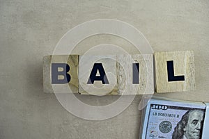 Concept of The wooden Cubes with the word BAIL on wooden background