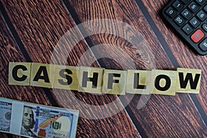 Concept of The wooden Cubes with the word Cashflow on wooden background