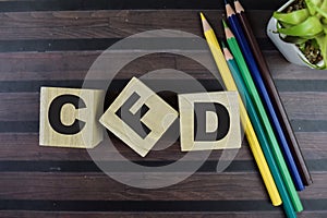 Concept of The wooden Cubes with the word CFD on wooden background photo