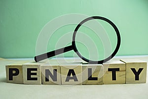 Concept of The wooden Cubes with the word Penalty on wooden background