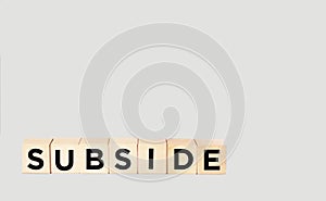 Concept of The wooden Cubes with the word Subsidy on wooden background