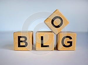 Concept word `blog` on wooden cubes on a beautiful white background. Business concept. Copy space