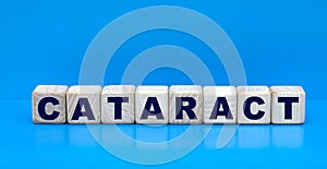 concept word CATARACT on cubes on a blue background