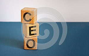 Concept word `CEO` on cubes on a beautiful blue background. Business concept. Copy space