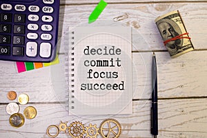 Concept word Decide Commit Focus Succeed on beautiful white paper