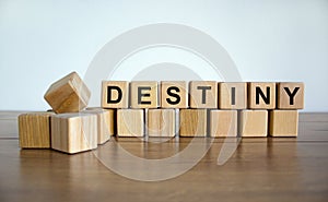 Concept word `destiny` on wooden cubes on a beautiful white background. Wooden table. Copy space. Business concept