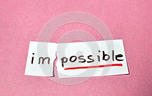 Concept of the word impossible written by hand