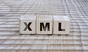 Concept of the word XML on cubes on a beautiful background