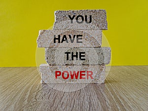 Concept word You have the power on brick block. Beautiful yellow background, wooden table. Business motivational you have the